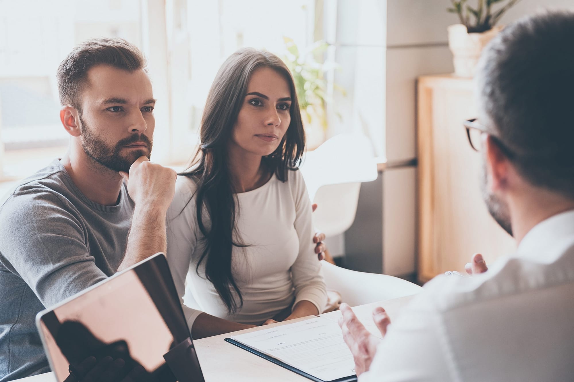 Listening,To,Financial,Advisor.,Concentrated,Young,Couple,Bonding,To,Each
